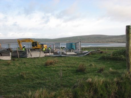 Click on image to see full-sized version Pallisade fences at compound overturned