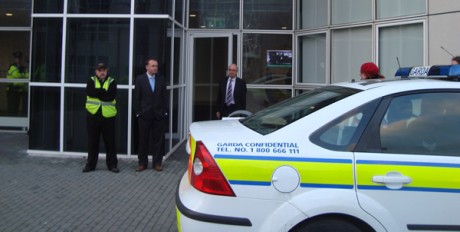 Click on image to see full-sized version Garda car awaits Dor Gold in order to help him make a quick exit from the building