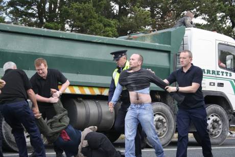Click on image to see full-sized version Dublin MEP Paul Murphy being dragged away