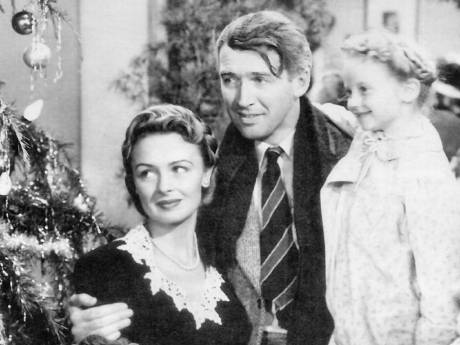 Click on image to see full-sized version George Bailey (James Stewart), Mary Bailey (Donna Reed), and their youngest daughter Zuzu (Karolyn Grimes) in It’s a Wonderful Life.