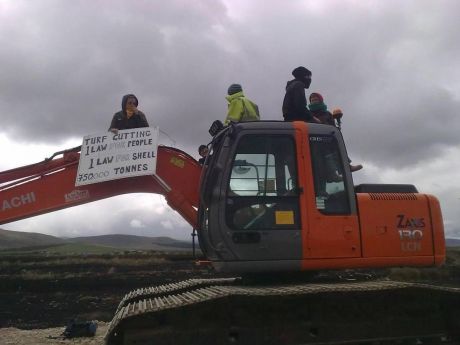 Click on image to see full-sized version On digger with sign