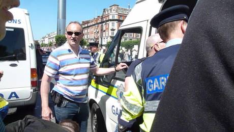 Click on image to see full-sized version The guard from Store Street Garda Station who arrested me (with sunglasses). Does anybody know who he is?