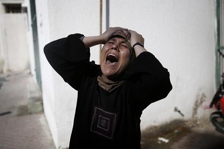 Click on image to see full-sized version Woman who lost her family (imemc.org - image by Amnesty International)