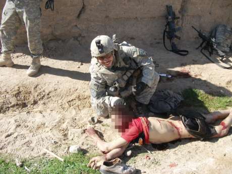 Click on image to see full-sized version In this image, a different soldier poses with the same corpse.