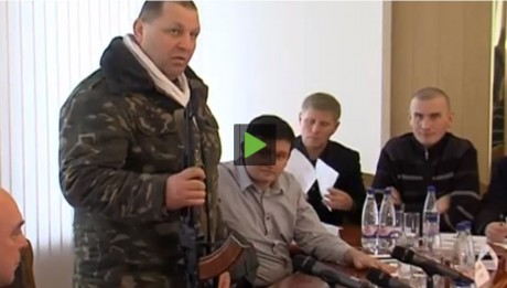 Click on image to see full-sized version 'I dare you to take my gun!' AK-47-toting Ukraine far-right leader Aleksandr Muzychko tells officials