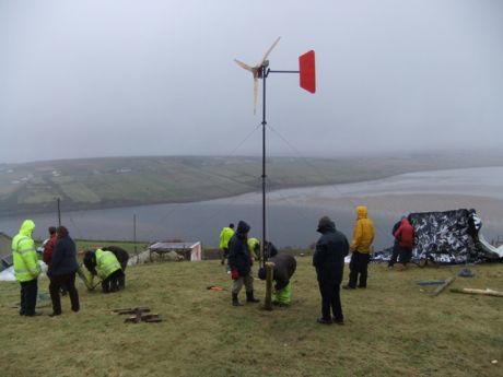 Click on image to see full-sized version Putting up the wind turbine