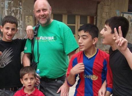 Click on image to see full-sized version Joe and some locals from the Palestinian refugee camp in Latakia